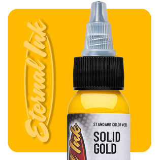 The Vegan Solid Gold Tattoo Ink by Eternal Ink in front of a solid gold branded product background.
